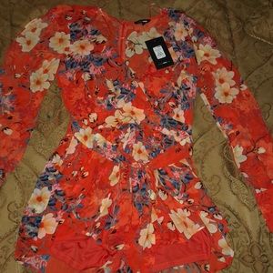 Open long sleeve romper.